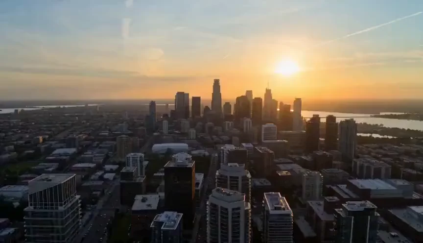 Aerial view of a city skyline at sunset
